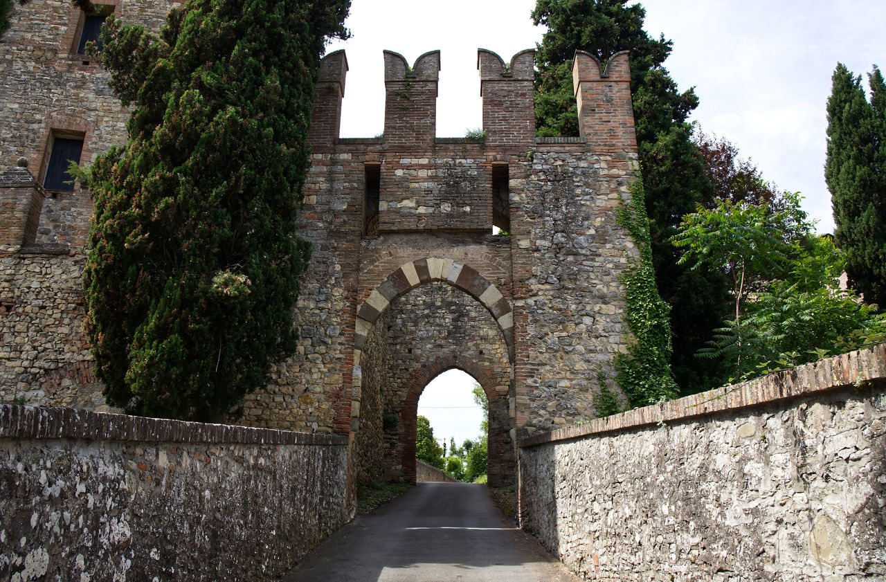 architecture, built structure, history, the past, building exterior, castle, building, travel destinations, tree, arch, nature, plant, wall, château, old, ruins, abbey, ancient, travel, sky, tourism, medieval, no people, day, wall - building feature, gate, outdoors, stone material, fort, stone wall, ancient history, city, old ruin, estate, footpath, fortification, the way forward, place of worship, religion