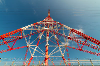 Low angle view of tower against blue sky