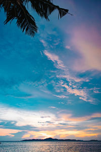 Low angle view of sea against sky during sunset