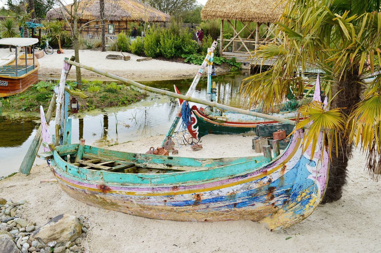 BOATS MOORED AT SHORE