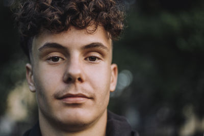 Portrait of teenage boy with curly hair