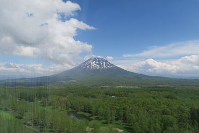 Scenic view of volcanic mountain against sky