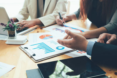 Group of people working on table