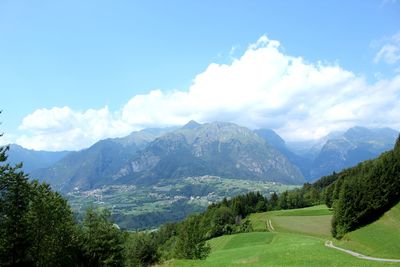 Scenic view of landscape and mountains against sky