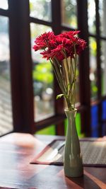 Close-up of flower pot on window sill