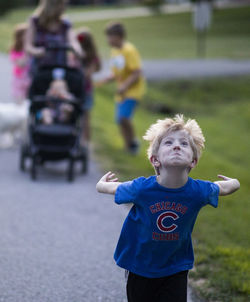 Full length of boy standing on field