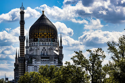 View of building against cloudy sky