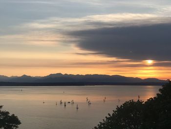 Scenic view of lake against sky during sunset