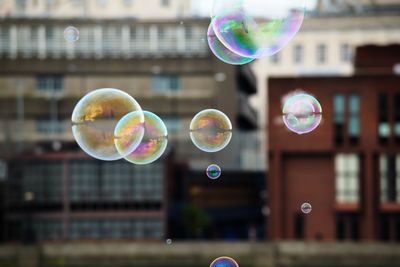 Close-up of bubbles against rainbow