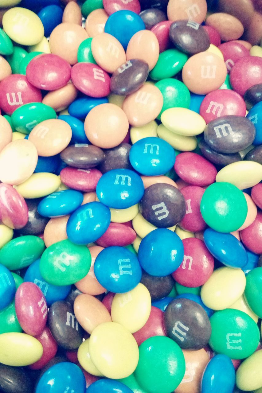 multi colored, large group of objects, abundance, variation, blue, full frame, indoors, colorful, backgrounds, still life, balloon, sphere, choice, arrangement, close-up, candy, purple, high angle view, ball, celebration