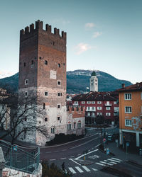 Old buildings in city against sky