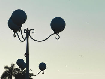 Low angle view of street light against sky