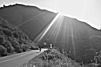 Rear view of man on mountain road