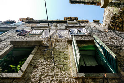 Low angle view of buildings against clear sky