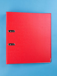 High angle view of red box on blue background