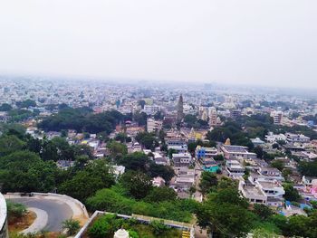 High angle view of buildings against clear sky