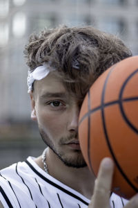Close-up of man playing basketball