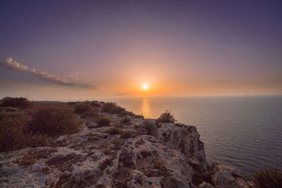 Scenic view of sea against sky during sunset
