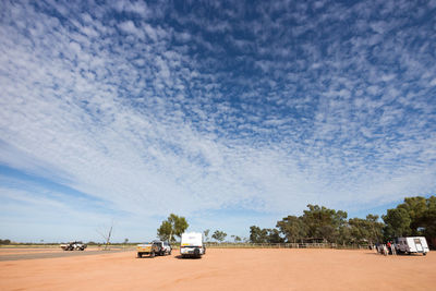 Cars on road against sky