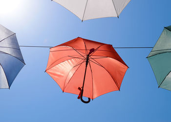 Low angle view of umbrella against sky