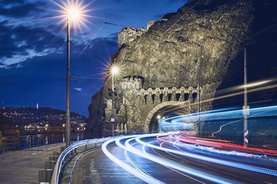 High angle view of light trails on road at night