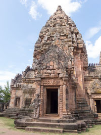 Old ruins of temple against cloudy sky