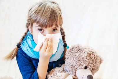 Close-up of girl with teddy bear