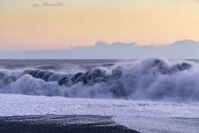 Scenic view of sea at sunset