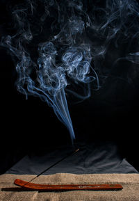 Close-up of smoke against black background