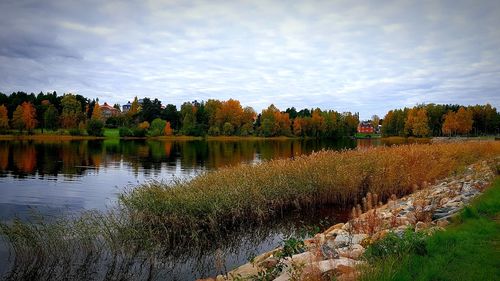 Scenic view of lake against sky during autumn