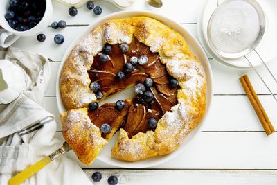 Fruit galette. homemade rustic pear tart with blueberry. healthy food.