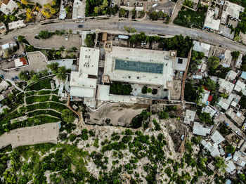 High angle view of trees and buildings in city