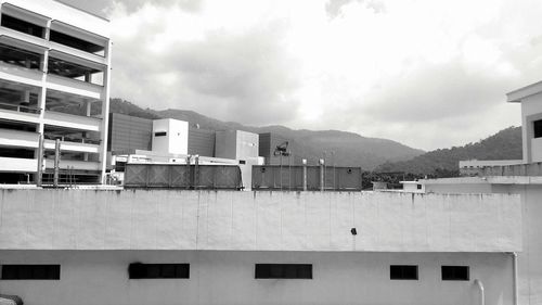 Houses against sky in city