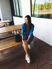 Contemplating mature woman looking while sitting on seat