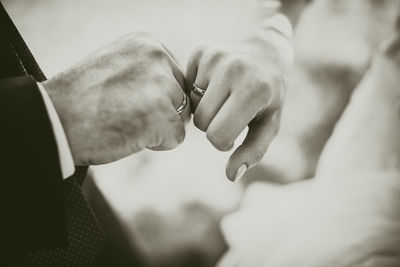 Cropped image of woman holding hands