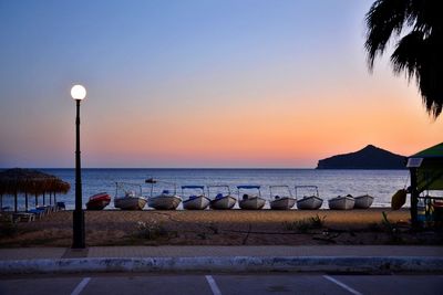 Scenic view of sea against clear sky at sunset