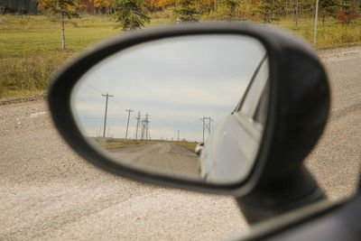 Reflection of road on side-view mirror