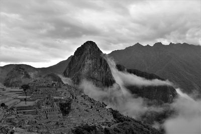 View of mountain range against cloudy sky