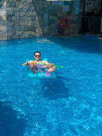 Woman swimming in pool