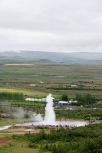 Scenic view of landscape against cloudy sky