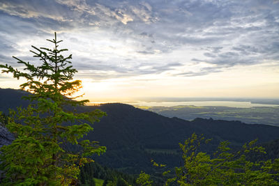 Scenic view of mountains against sky at sunset