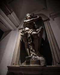 Low angle view of statue against temple