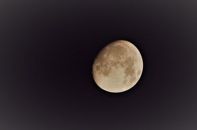 Low angle view of moon against clear sky at night