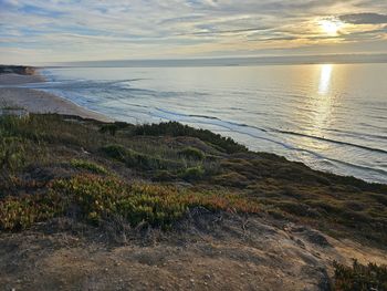 Scenic view of sea against sky during sunset