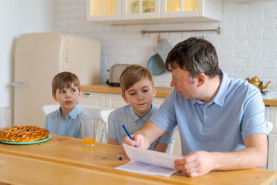 Side view of man working at home