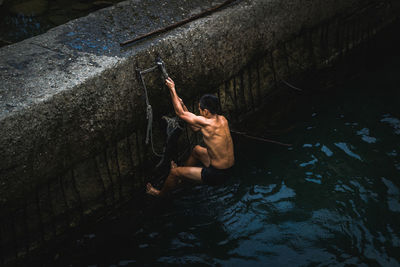 High angle view of man swimming in lake