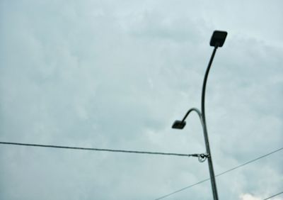 Low angle view of street light against sky