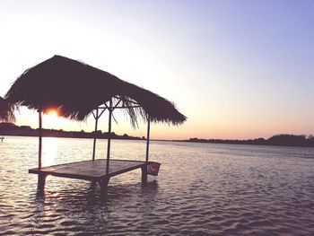 Scenic view of sea against clear sky during sunset