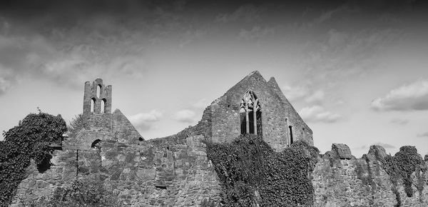 Low angle view of old building against sky