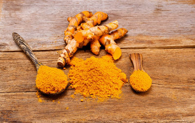 Close-up of turmeric on wooden table